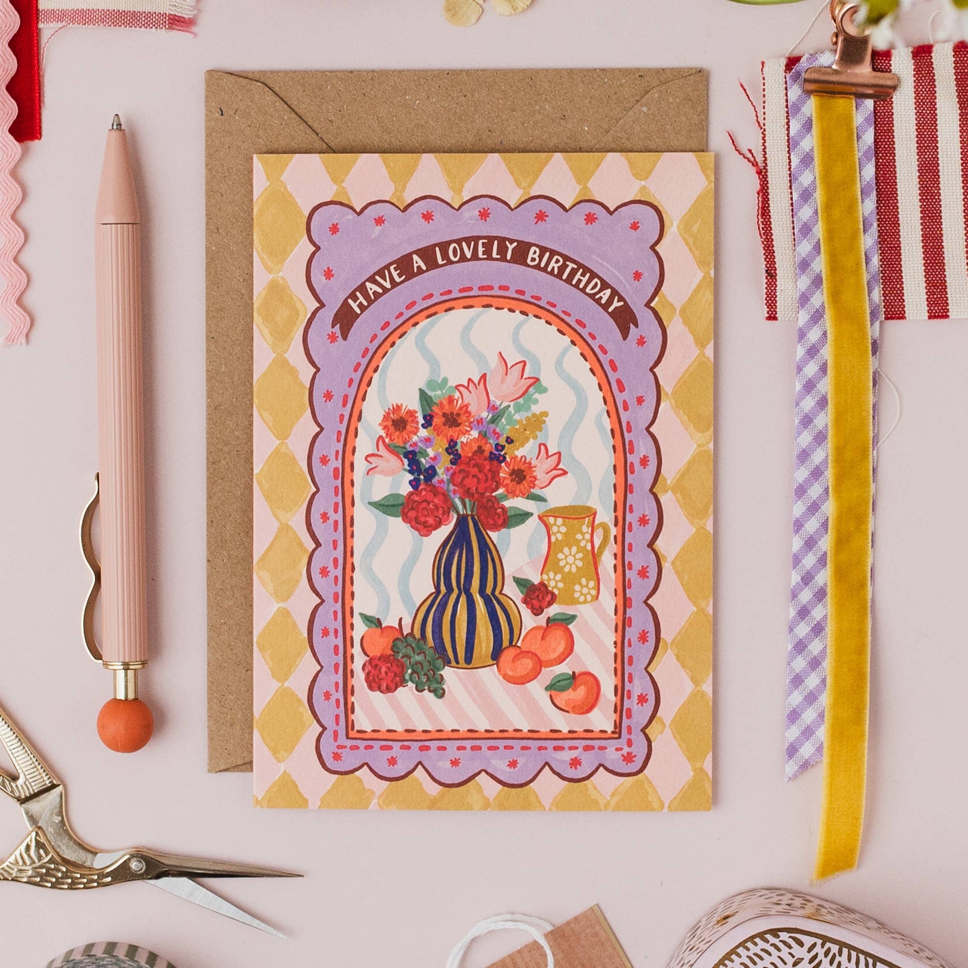 Birthday card with kraft envelope, showing textured card detail