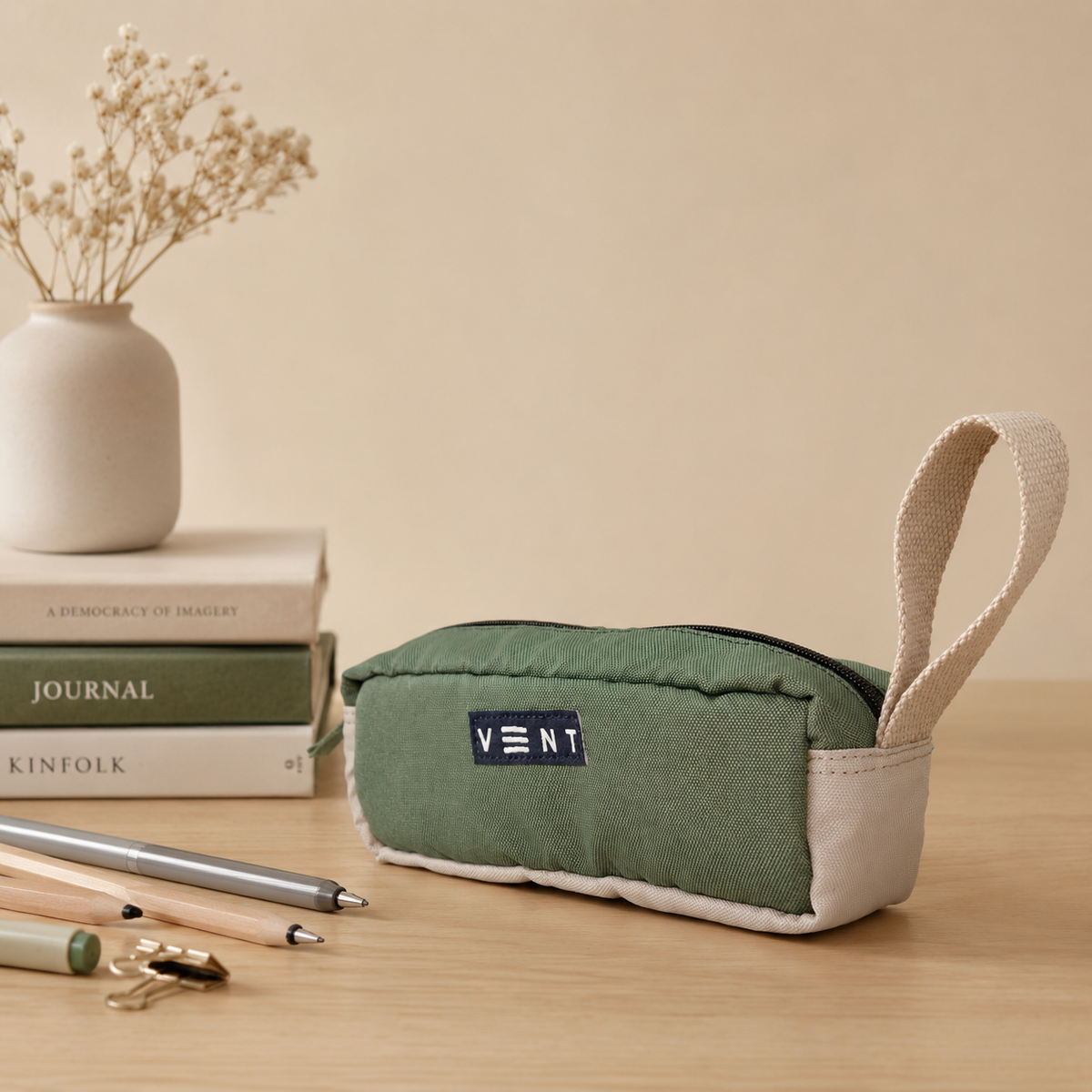 Side view of sage green recycled ocean plastic pencil case with handle