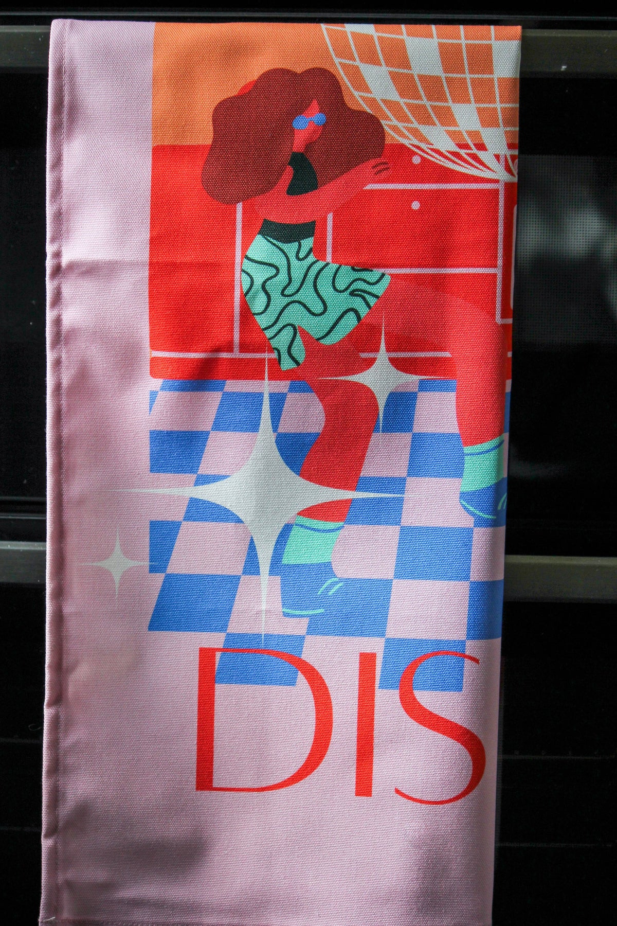 UK made pink disco tea towel displayed in a modern kitchen