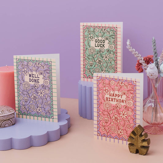 Close-up detail of the intricate pink and orange floral design on 'Lovely Sister' card