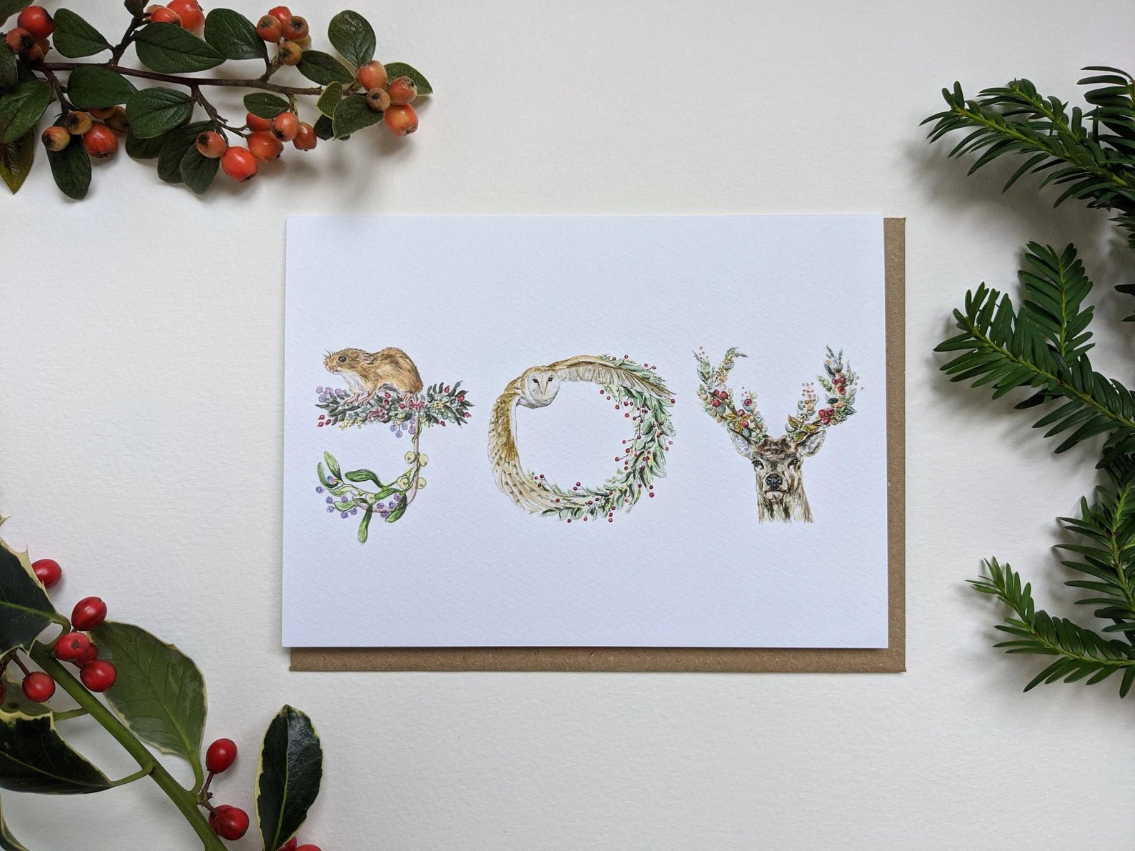 Elegant 'JOY' Christmas card, 177x127mm, textured paper, featuring UK woodland creatures design.