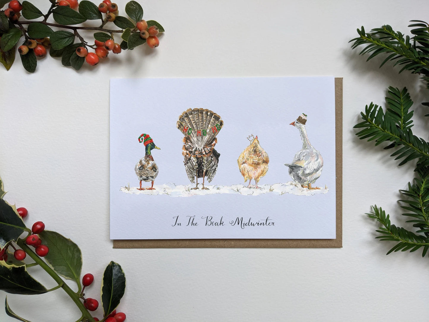 Humorous Christmas card by Jessica Kendrew with turkey, goose, duck, chicken in Santa hats, showing their bottoms
