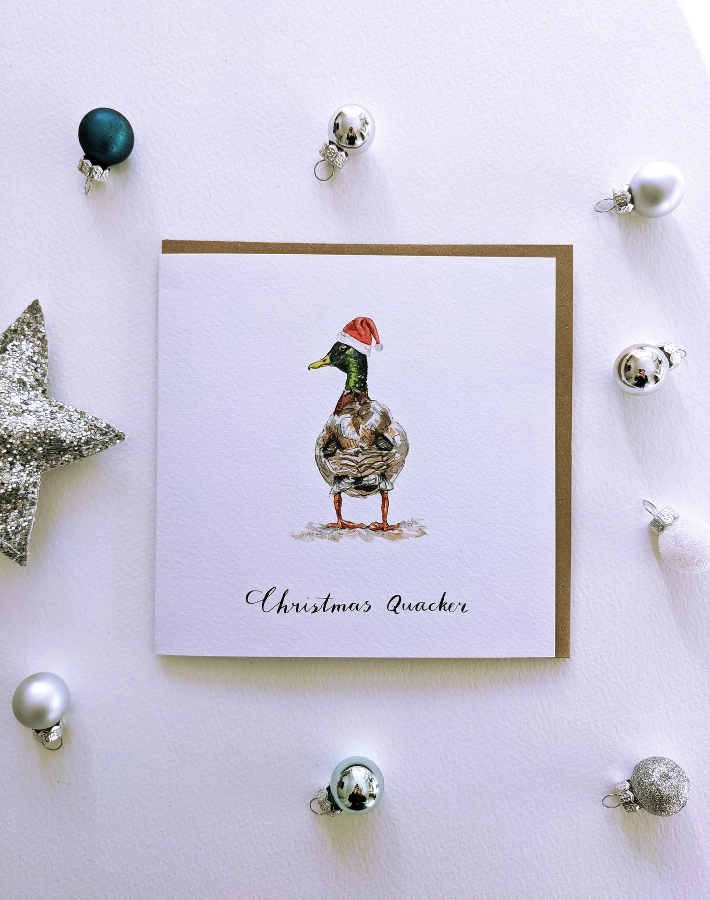 Charming Christmas Quacker duck greeting card with a mallard in a festive hat, front view