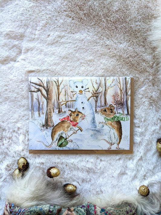 Front view of Jessica Kendrew's Christmas Mice making a Snowman greeting card, featuring a charming woodland illustration.