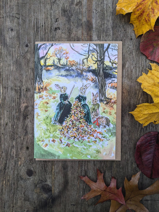 Woodland Rabbits Raking Autumn Leaves Greeting Card by Jessica Kendrew