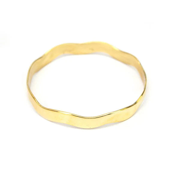 Gold-tone recycled brass wavy bangle bracelet, handcrafted in Kenya by husband-and-wife artisans, Anton & Benta.