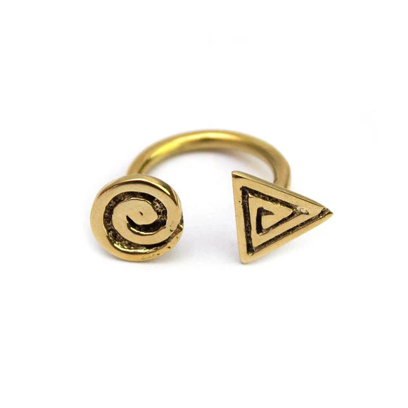Close-up of Nakuru Recycled Brass Open Ring, showcasing unique swirl texture and warm gold tone on a model's finger.