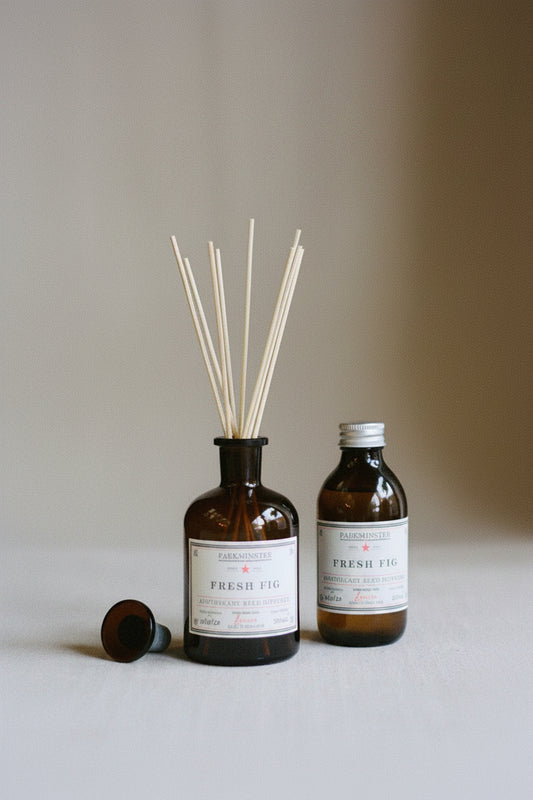 Two bottles of 'Fresh Fig' diffuser on a neutral background