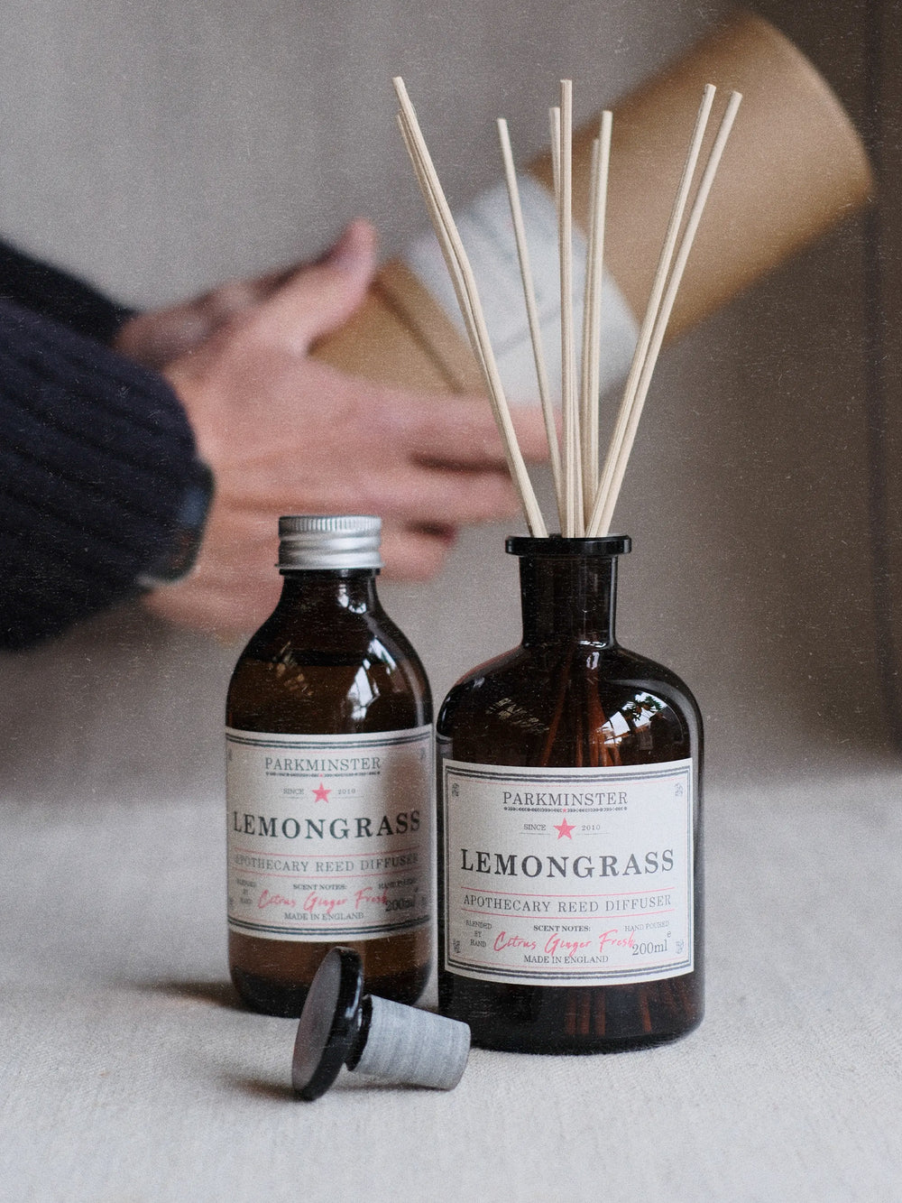 Eco-friendly 200ml apothecary style reed diffuser on a flat surface