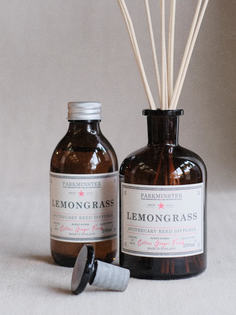 Lemongrass Apothecary Reed Diffuser in amber glass bottle with natural reeds