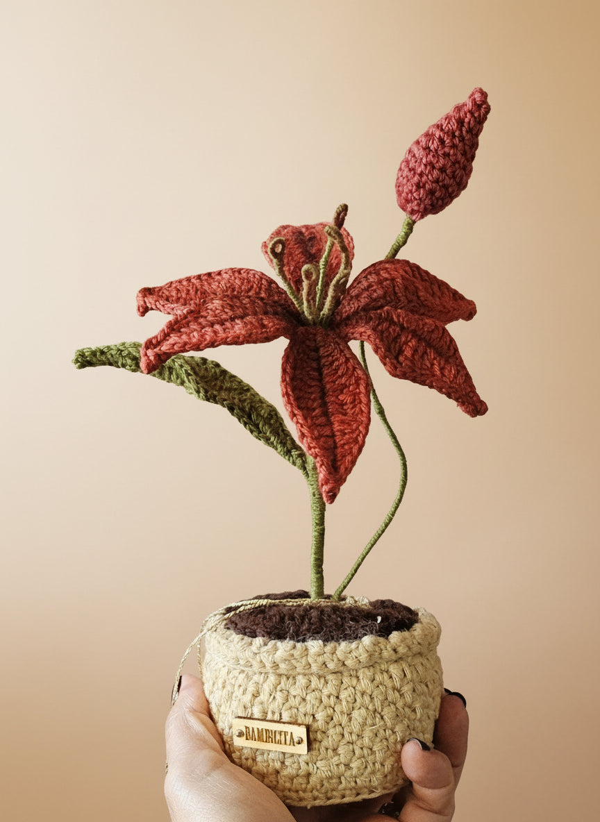 Handmade potted crochet flower brightening a windowsill