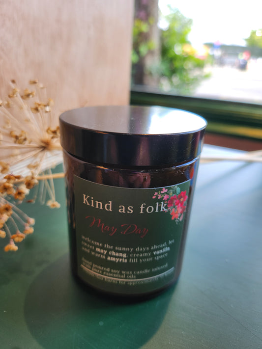 Handmade soy wax candle in amber glass jar with natural vanilla and citrus essential oils, perfect for sustainable summer living