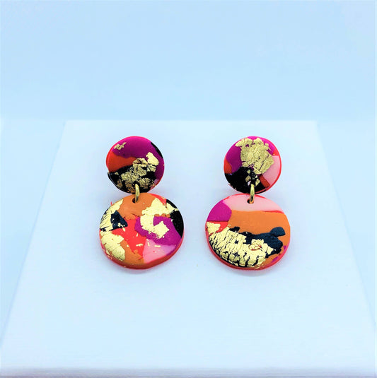 Close-up of Fire & Flood Mini Polymer Clay Earrings on a white background, showcasing unique design and texture.