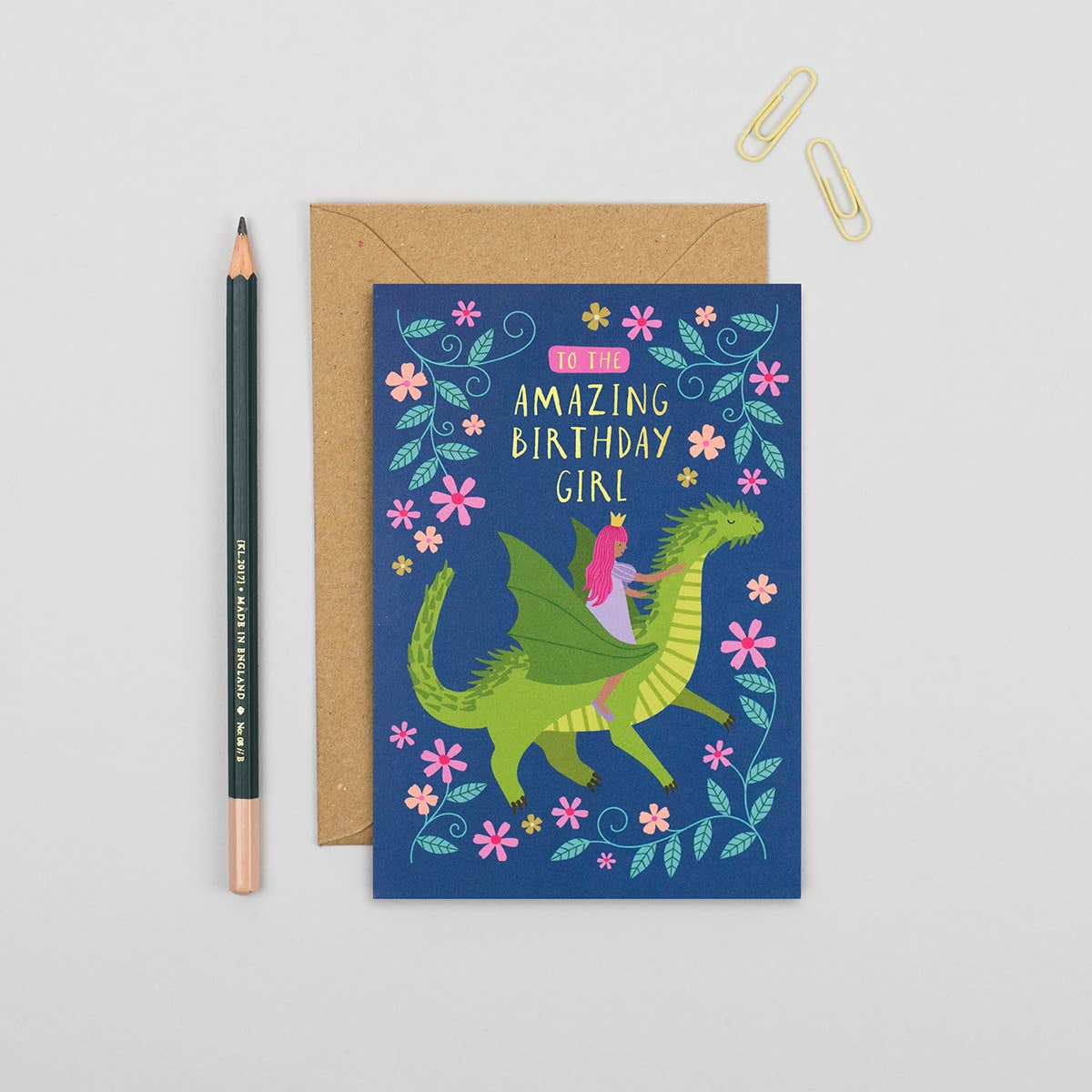 The Princess and the Dragon Birthday Card. A sweet, illustrated birthday card for kids featuring a princess riding on a cute green dragon and the caption “To the Amazing Birthday Girl”. This kid’s birthday card is a luxury, finished design complete with gold foil details, making for a shiny celebration for any little girl. Make a memorable impact with the all ages children's birthday card, which brings fun fantasy elements full of wonder.