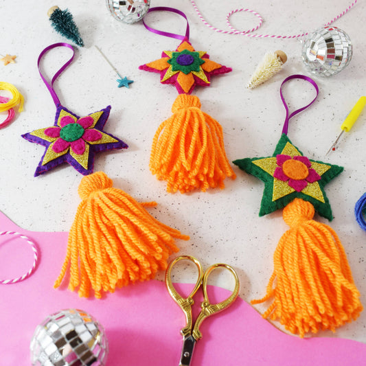 Create a set of twinkly stars with tassel tails with this beautiful decoration set. Stitch the felt and create the tassels to make a set of ornaments for your tree. Our felt project kits are great for beginners as the kit contains everything you'll need to sew and assemble the beautiful decorations. Learn to sew and decorate your home with some handmade ornaments this Christmas.